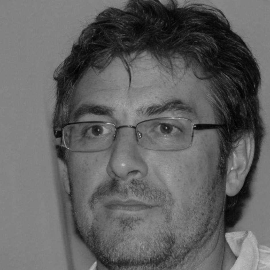 Professional headshot of financial expert and instructor
